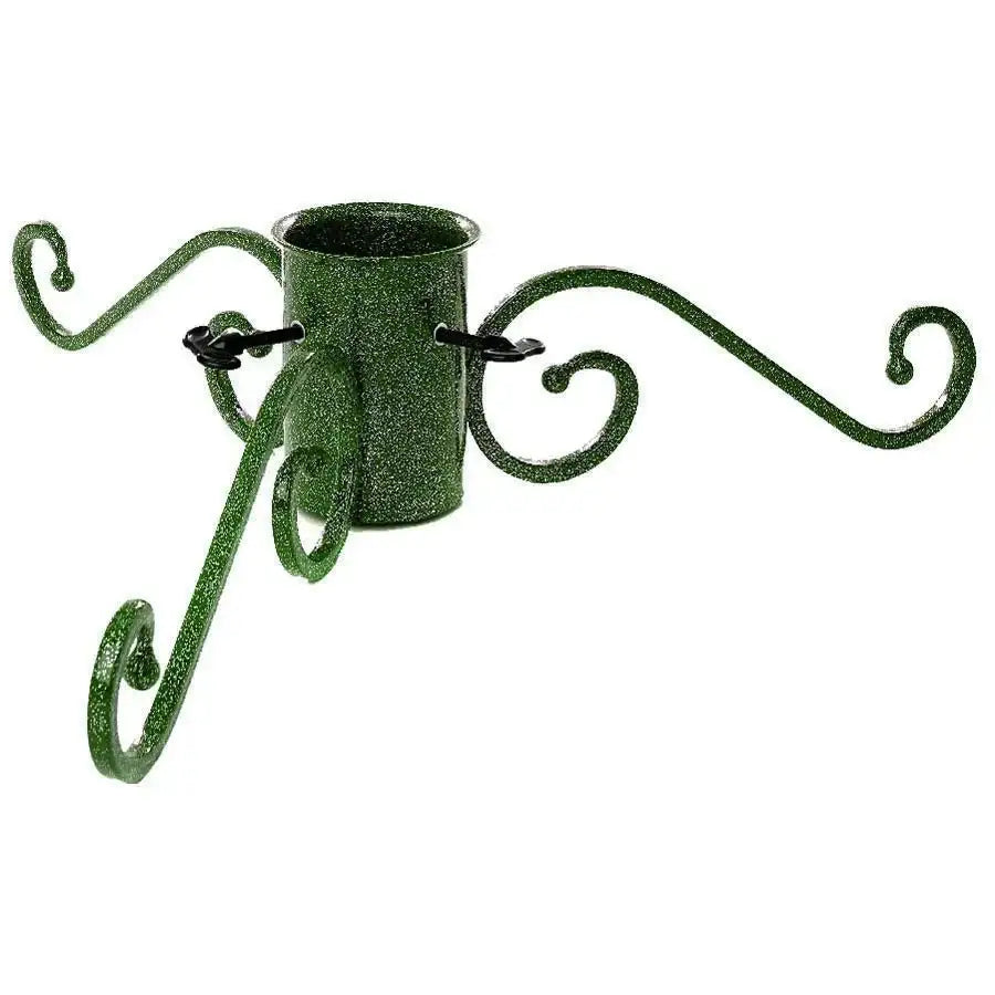 Green glitter metal Christmas tree stand with decorative scroll design, isolated on white