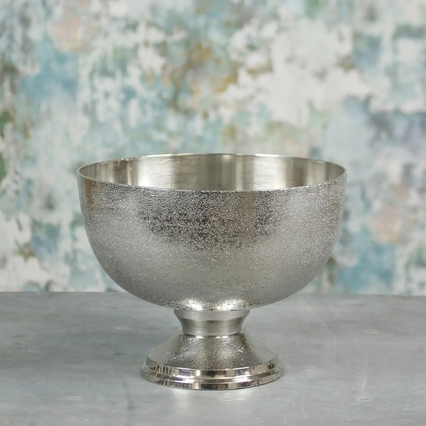 Elegant silver pedestal bowl with textured finish, perfect for home décor or gifting on special occasions.