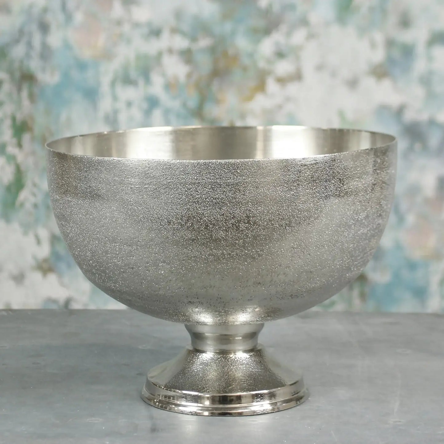Elegant silver pedestal bowl with textured finish, perfect for home décor or gifting