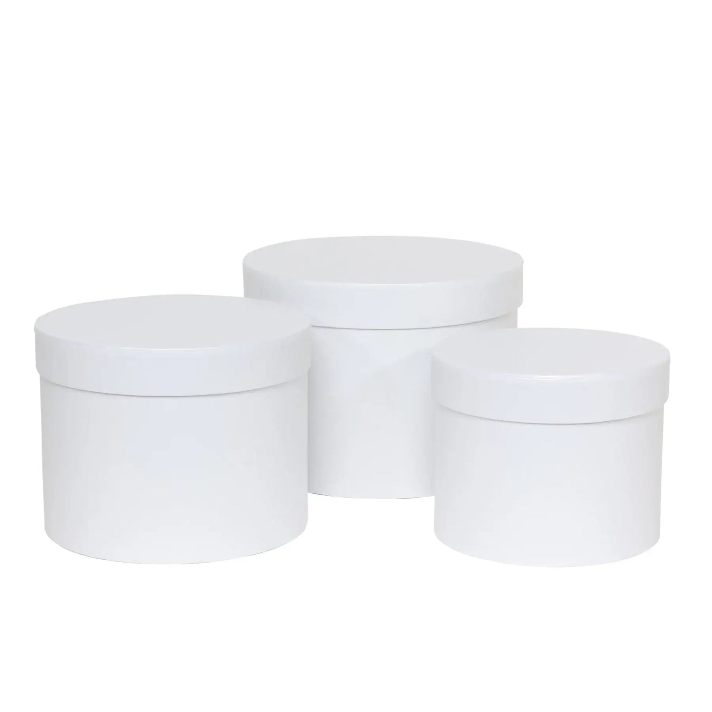 Set of three white round storage boxes with lids, ideal for home organization and gift wrapping