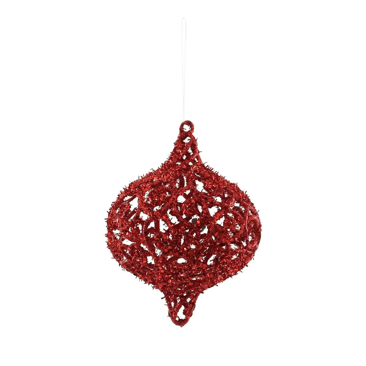 Red glittery Christmas ornament with intricate openwork design, hanging on white background