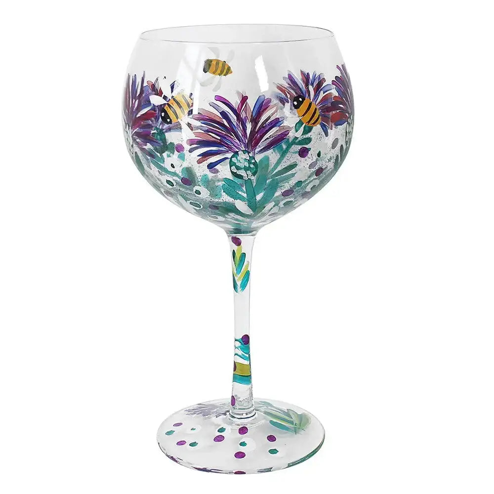 Hand-painted wine glass with purple flowers and yellow bees design