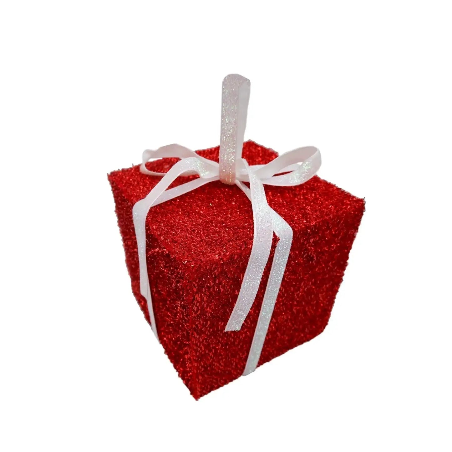 Red glitter gift box ornament with white ribbon on white background