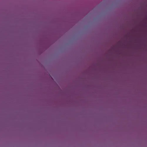 Purple mesh decorative roll on matching background, ideal for gift wrapping or crafts