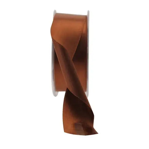 Rich brown satin ribbon spool for gift wrapping and home décor accents
