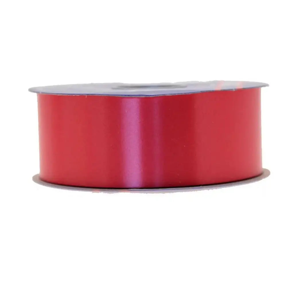 Red satin ribbon spool for gift wrapping and home décor accents