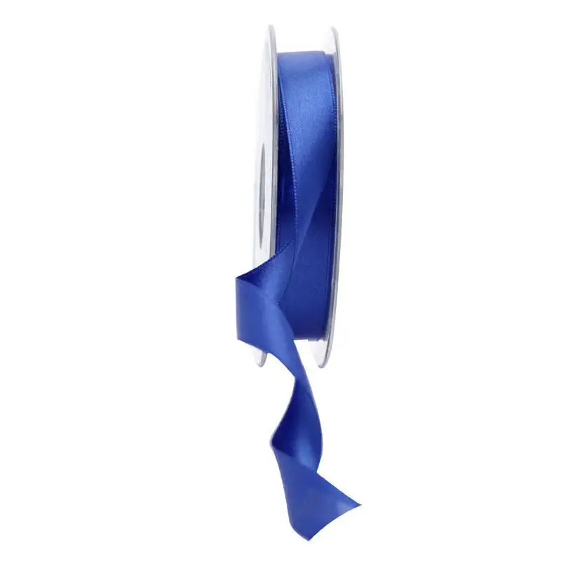 Royal blue satin ribbon spool for gift wrapping and home décor accents