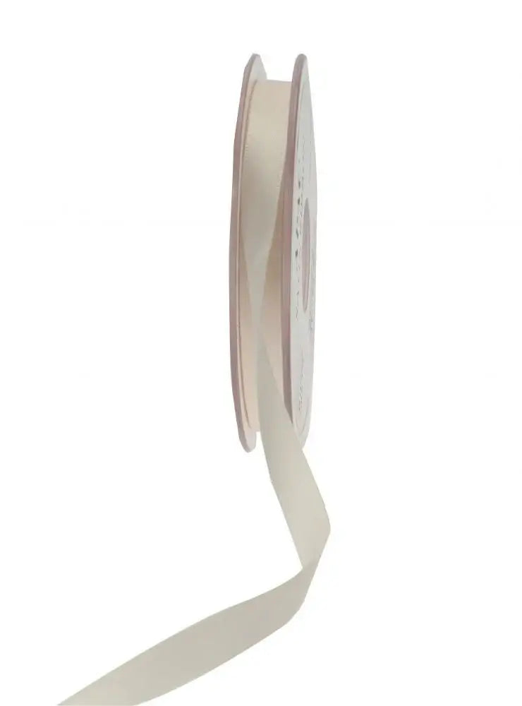 Cream satin ribbon spool for gift wrapping and home décor accents