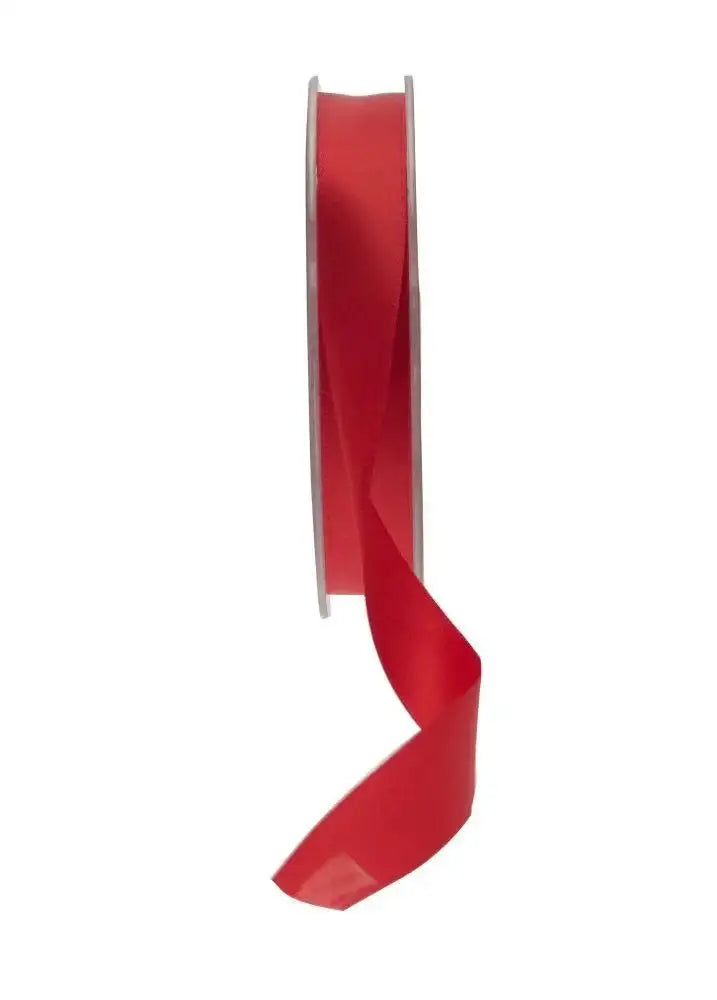 Red satin ribbon spool for gift wrapping and home décor accents