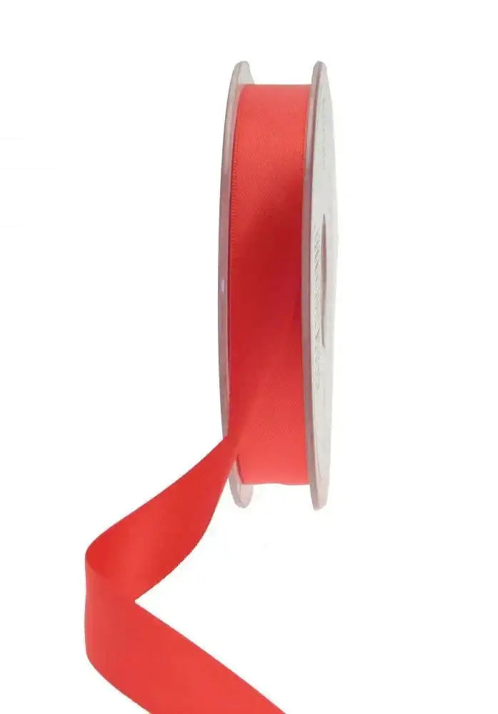 Vibrant red satin ribbon spool for gift wrapping and home décor accents
