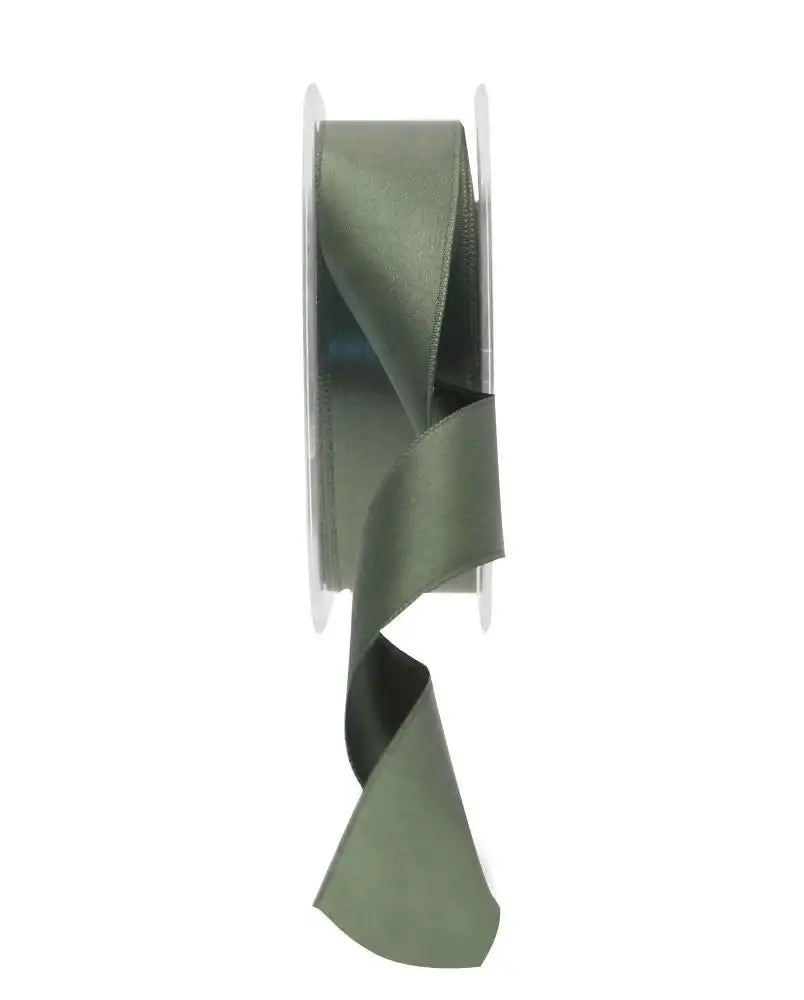 Sage green satin ribbon spool for gift wrapping and home décor accents