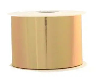 Shiny gold ribbon spool for gift wrapping and home décor accents