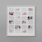 Baby's first milestones photo frame with multiple baby pictures and milestone cards on a grey wall.