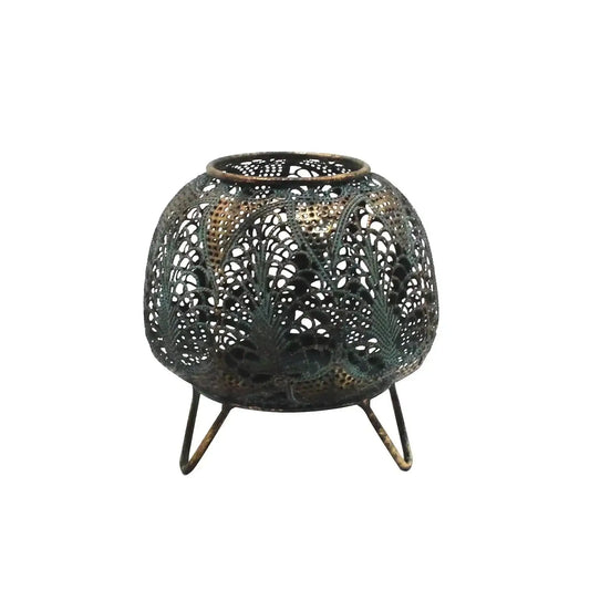 Decorative metal lantern with intricate cutout patterns on tripod legs, home décor accent