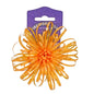 Orange gift bow with curled ribbons on purple packaging for present decoration.