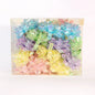 Box of assorted pastel gift bows for presents and decorations