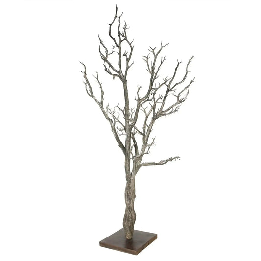 Decorative artificial tree with bare branches on a wooden base for home décor