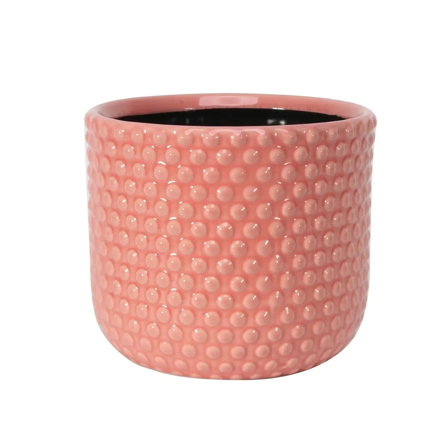 Pink ceramic planter pot with raised dot texture, modern home décor accessory.