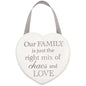 Heart-shaped hanging sign with 'Our family is just the right mix of chaos and love' text.