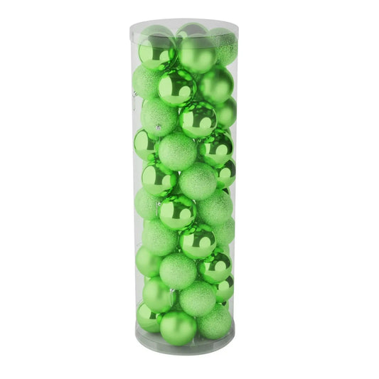 Green Christmas ornaments in clear tube, shiny and glittery holiday décor for tree or gift
