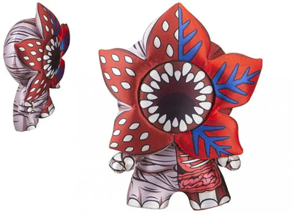 Plush toy with flower-shaped head, red petals, white spots, and blue accents for home decor