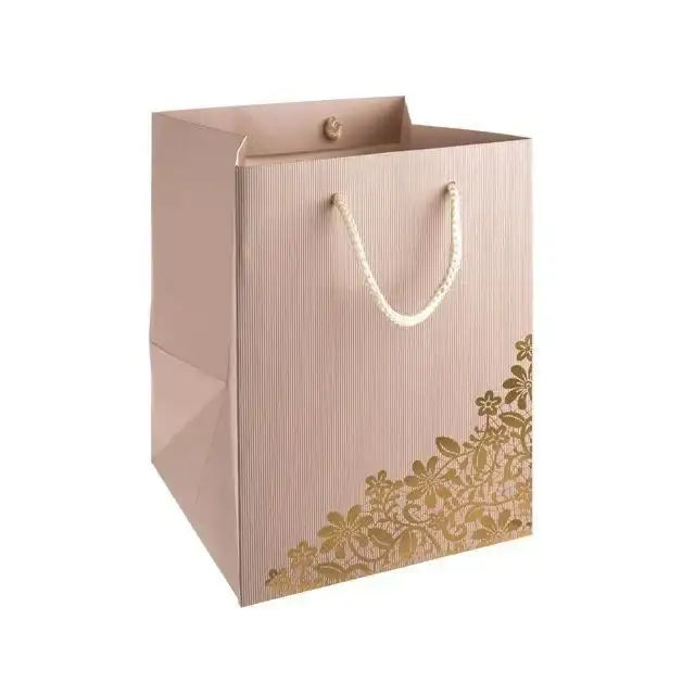 Elegant pink gift bag with gold floral design and rope handles, perfect for special occasions