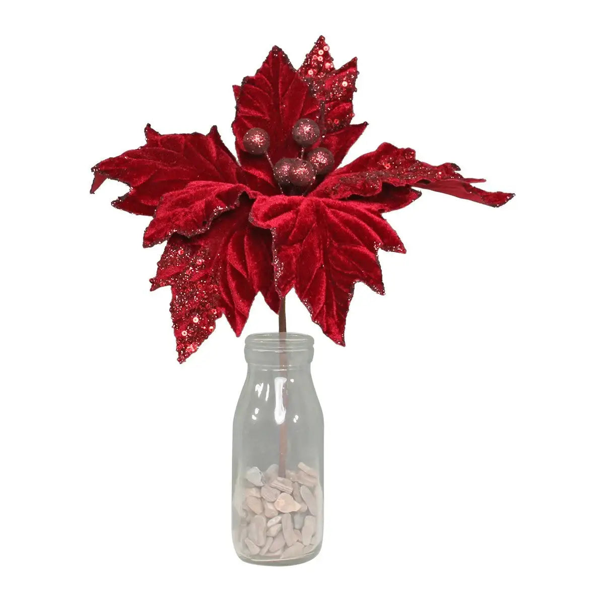 Red velvet poinsettia with glitter accents in glass milk bottle vase, festive holiday décor