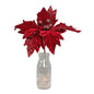 Red velvet poinsettia with glitter accents in glass milk bottle vase, festive holiday décor