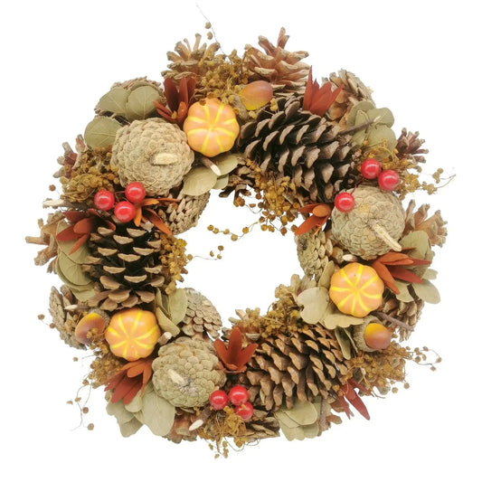 Autumn wreath with pinecones, mini pumpkins, berries & dried leaves for seasonal home décor