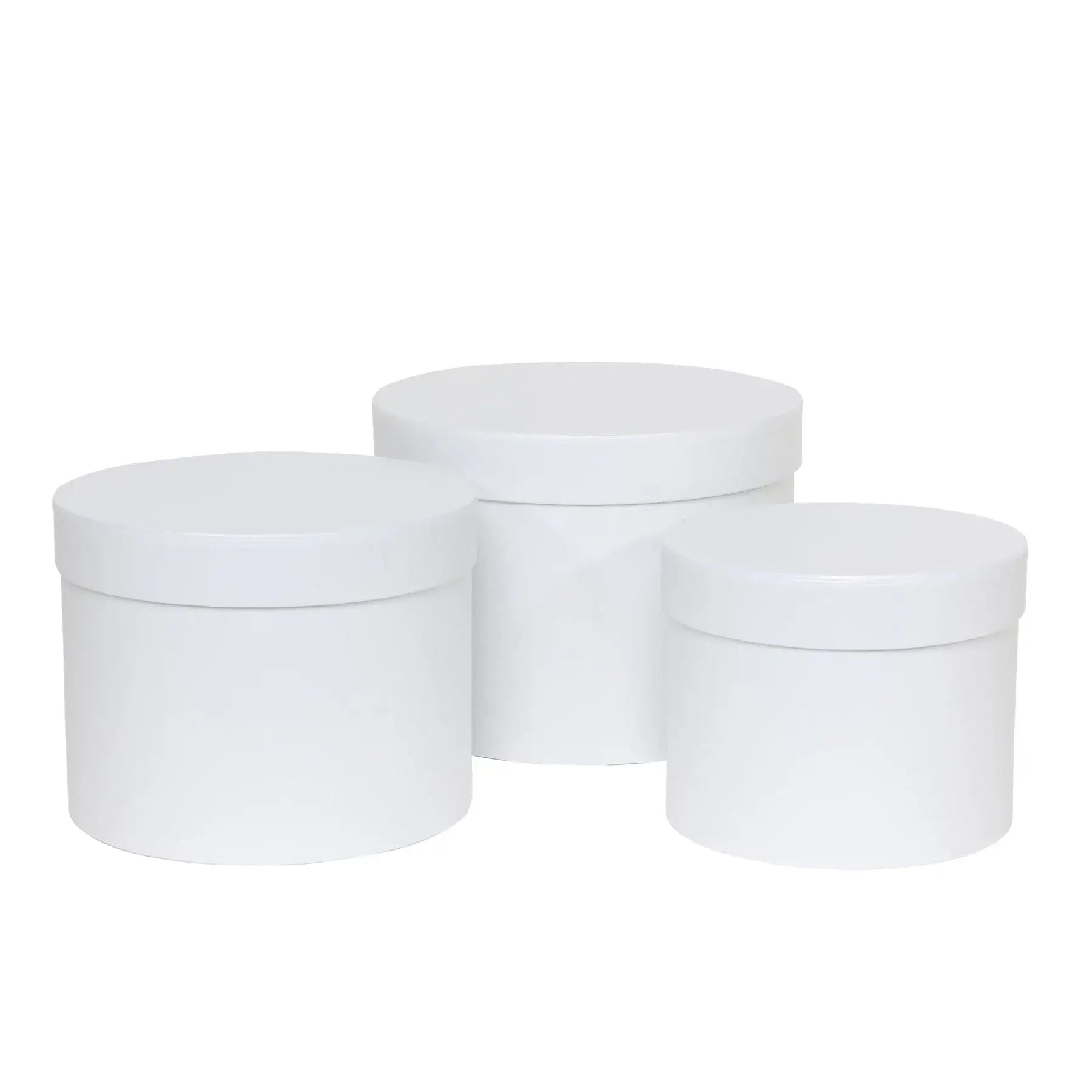 Set of three white round storage boxes with lids, ideal for home organization and gift wrapping