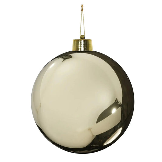 Shiny gold Christmas bauble with reflective surface and gold cap, perfect for festive home décor