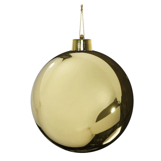Shiny gold Christmas ornament with reflective surface and hanging loop, perfect for holiday tree décor