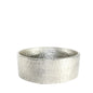 Hammered silver metal decorative bowl with textured finish on white background