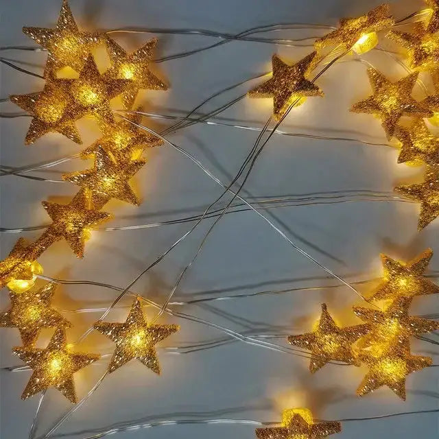 Golden star string lights glowing, perfect for festive home décor or celebrations.