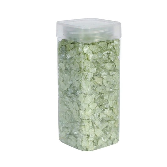 Clear plastic container filled with light green decorative glass stones