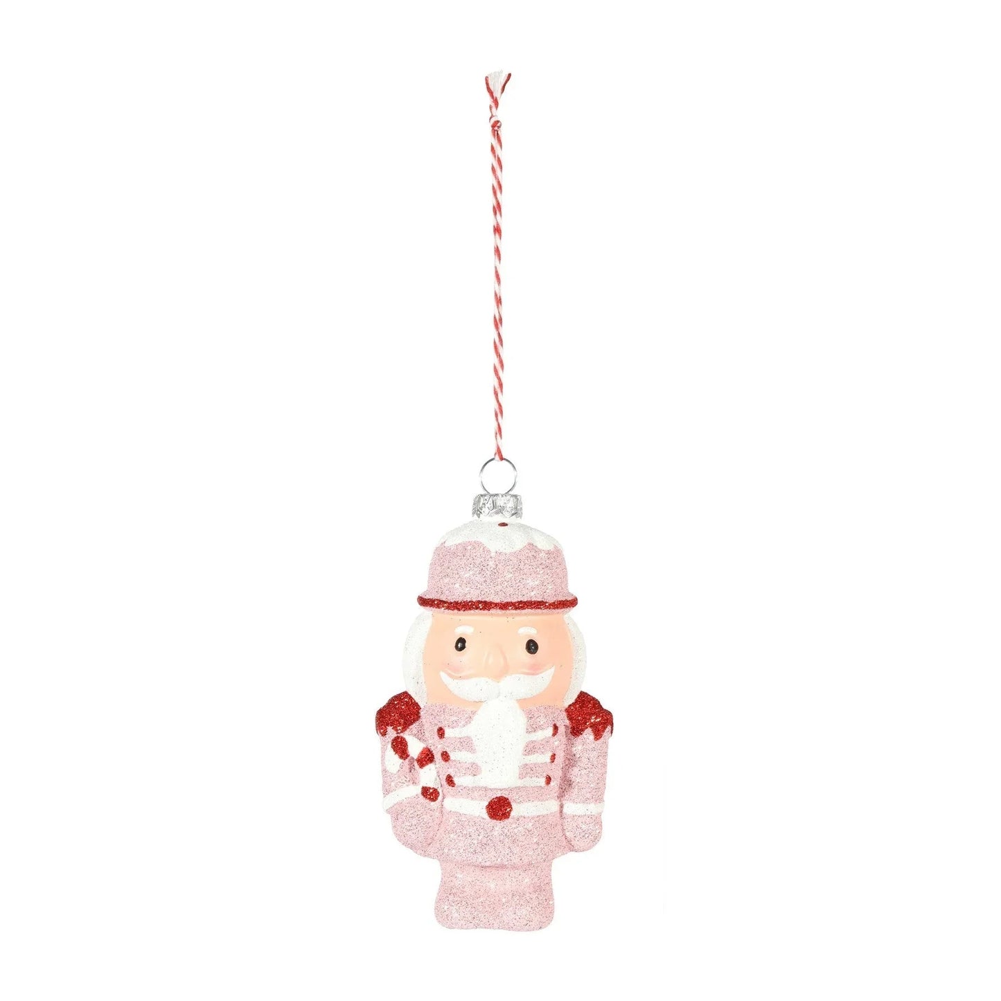 Pink glitter nutcracker Christmas tree ornament with red accents and striped hanging string