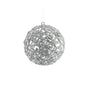 Silver glitter filigree Christmas ornament ball with sequins on white background