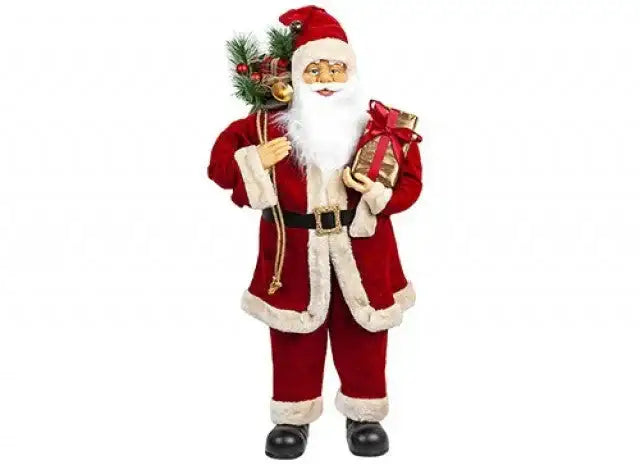 Santa Claus figurine holding gift and festive greenery, Christmas holiday décor