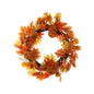 Autumn wreath with orange leaves, pumpkins, and berries for seasonal home decor