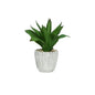 Artificial green succulent plant in textured gray pot with decorative pebbles, modern home décor