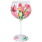 Hand painted wine glass with vibrant pink and yellow tulip floral design
