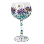 Hand-painted wine glass with purple flowers and yellow bees design