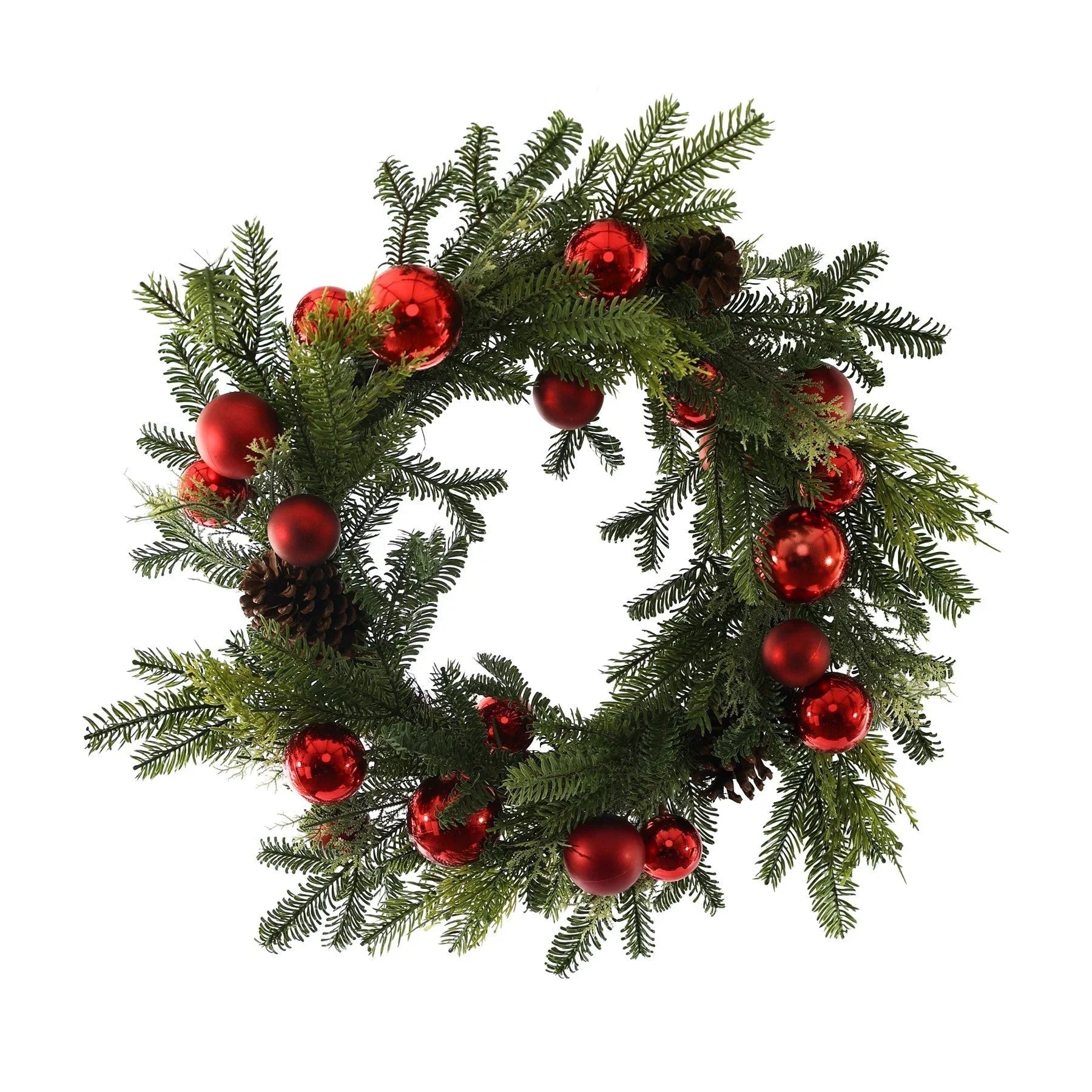 Christmas wreath with pine branches, red ornaments, and pinecones on white background