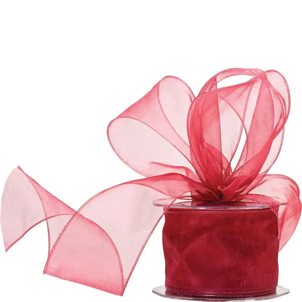 Red organza ribbon spool with decorative bow for gift wrapping and home décor