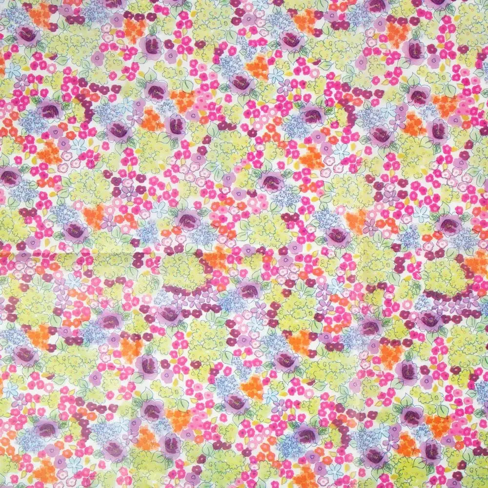 Colorful floral patterned fabric with pink, yellow, orange and purple flowers