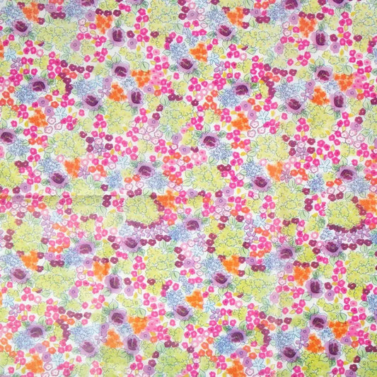 Colorful floral patterned fabric with pink, yellow, orange and purple flowers