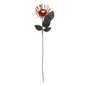 Artificial orange spider flower stem with a central eyeball detail and black leaves