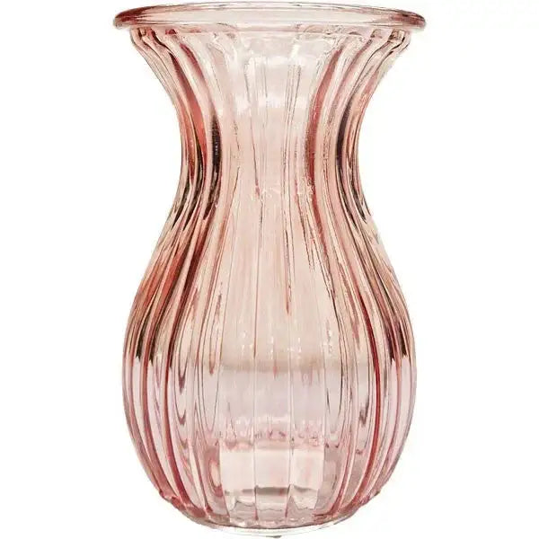 Pink ribbed glass vase with fluted design, ideal for home decor or gifting