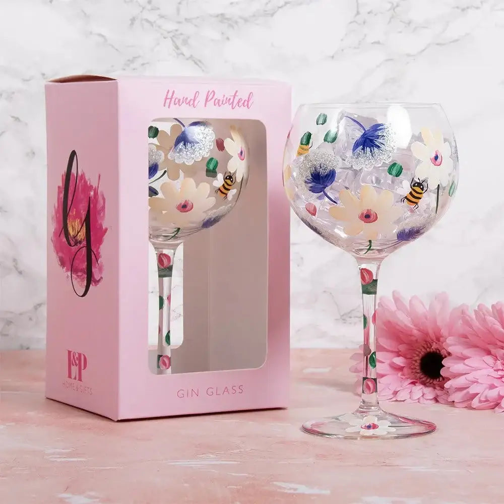 Hand painted gin glass with floral and bee designs, gift box, and pink daisy decor