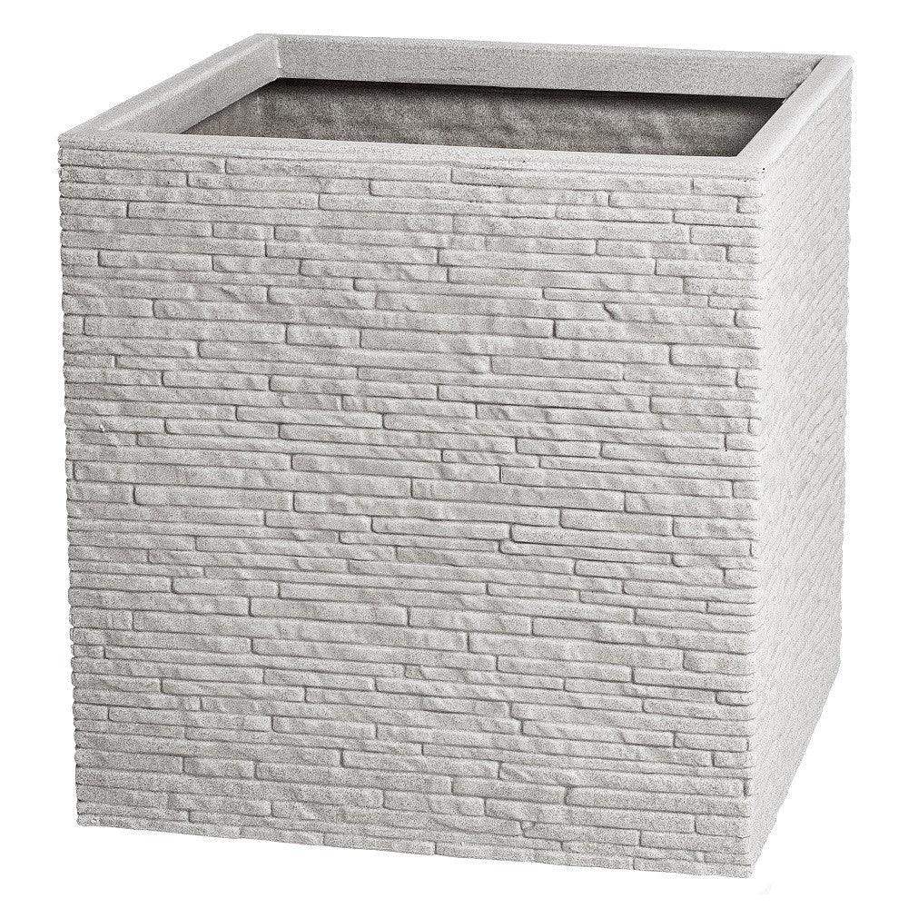 Modern square stone planter with textured brick design, ideal for home décor or garden use